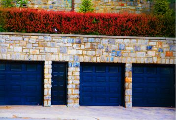 Three Black Garage Doors with Stone Exterior in Blaine MN